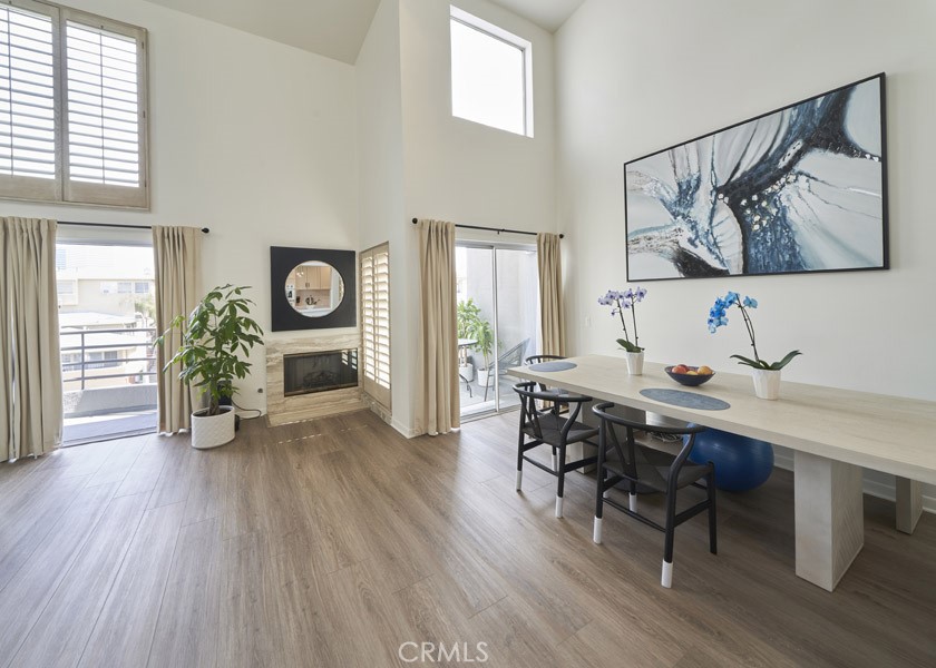 1617 South Beverly Glen Boulevard, Unit 303 Los Angeles, CA 90024 - Photo 20 of 55 a view of a dining room with furniture window and wooden floor