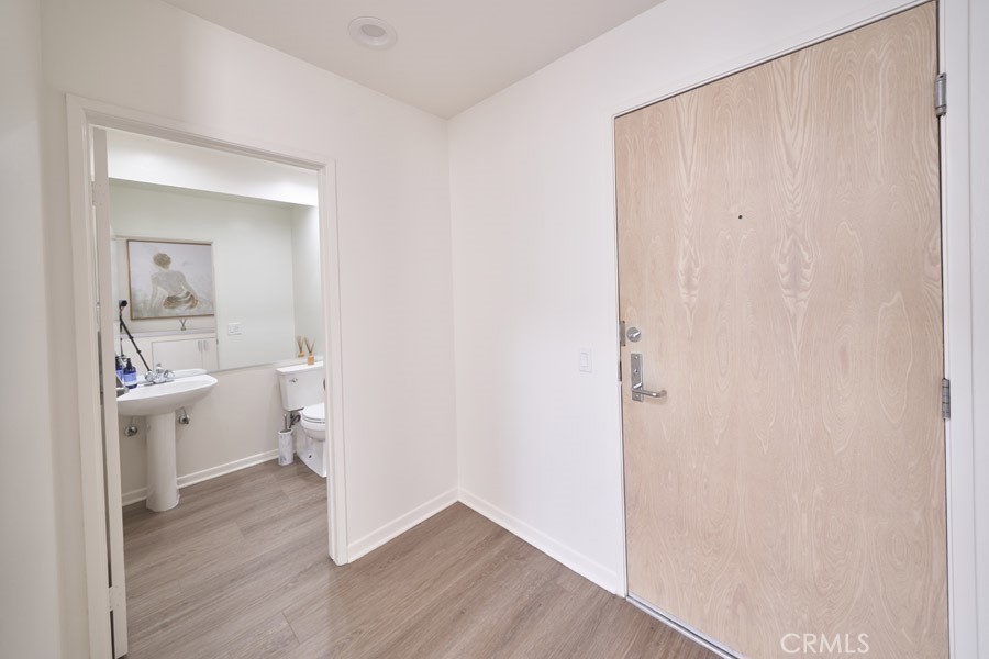 1617 South Beverly Glen Boulevard, Unit 303 Los Angeles, CA 90024 - Photo 23 of 55 a view of bathroom with a toilet a sink and a mirror