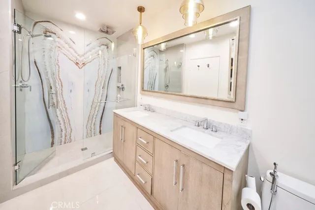 a bathroom with a double vanity sink mirror and double