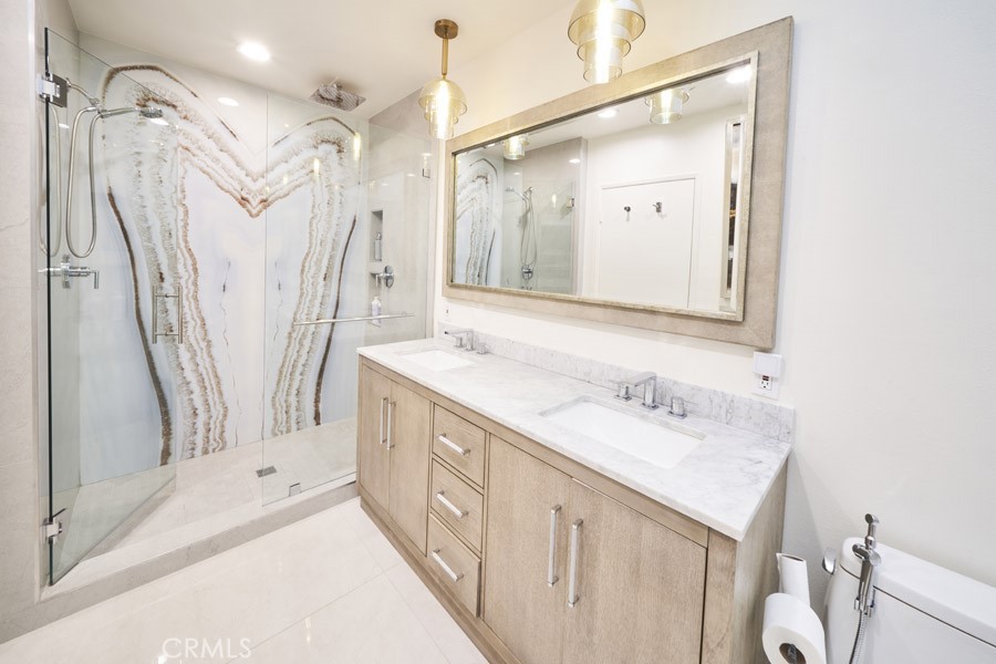 1617 South Beverly Glen Boulevard, Unit 303 Los Angeles, CA 90024 - Photo 29 of 55 a bathroom with a double vanity sink mirror and double