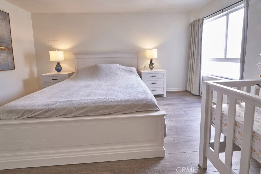 1617 South Beverly Glen Boulevard, Unit 303 Los Angeles, CA 90024 - Photo 33 of 55 a bedroom with a bed and window