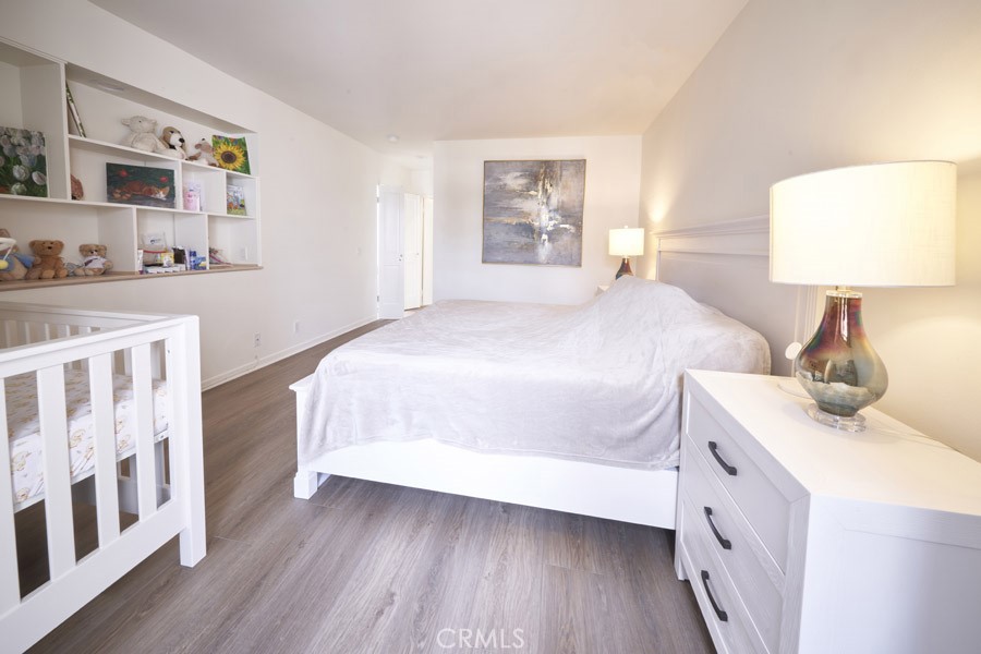 1617 South Beverly Glen Boulevard, Unit 303 Los Angeles, CA 90024 - Photo 34 of 55 a bed room with a bed and a night stand