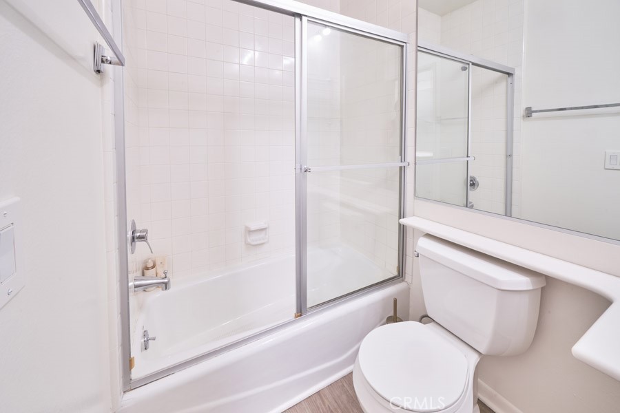 1617 South Beverly Glen Boulevard, Unit 303 Los Angeles, CA 90024 - Photo 36 of 55 a white toilet sitting next to a bath tub