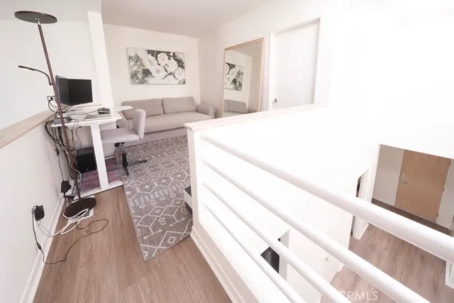 a view of a living room with wooden floor