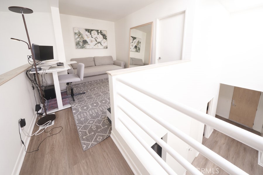 1617 South Beverly Glen Boulevard, Unit 303 Los Angeles, CA 90024 - Photo 42 of 55 a living room with furniture and wooden floor