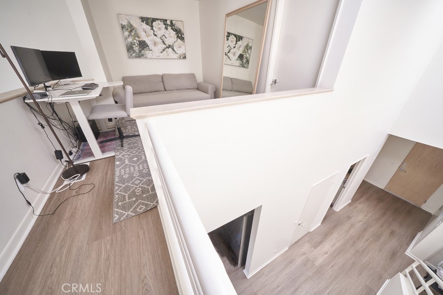 1617 South Beverly Glen Boulevard, Unit 303 Los Angeles, CA 90024 - Photo 43 of 55 a view of a living room with wooden floor