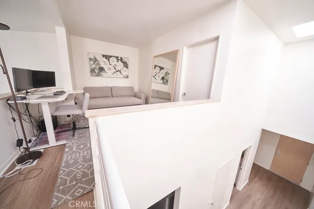 a view of a livingroom with furniture and window