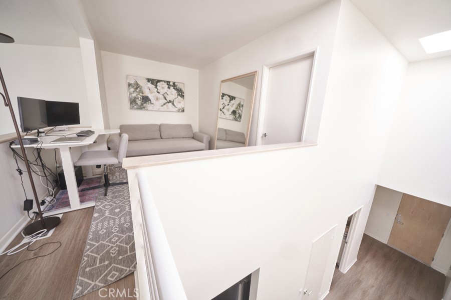 1617 South Beverly Glen Boulevard, Unit 303 Los Angeles, CA 90024 - Photo 44 of 55 a living room with a couch and a flat screen tv