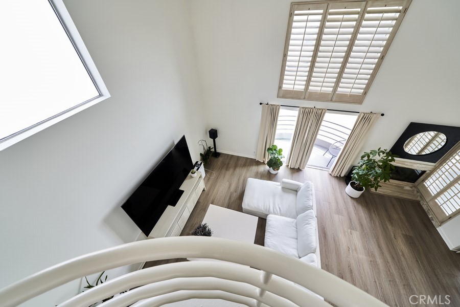 1617 South Beverly Glen Boulevard, Unit 303 Los Angeles, CA 90024 - Photo 6 of 55 a living room with furniture and wooden floor