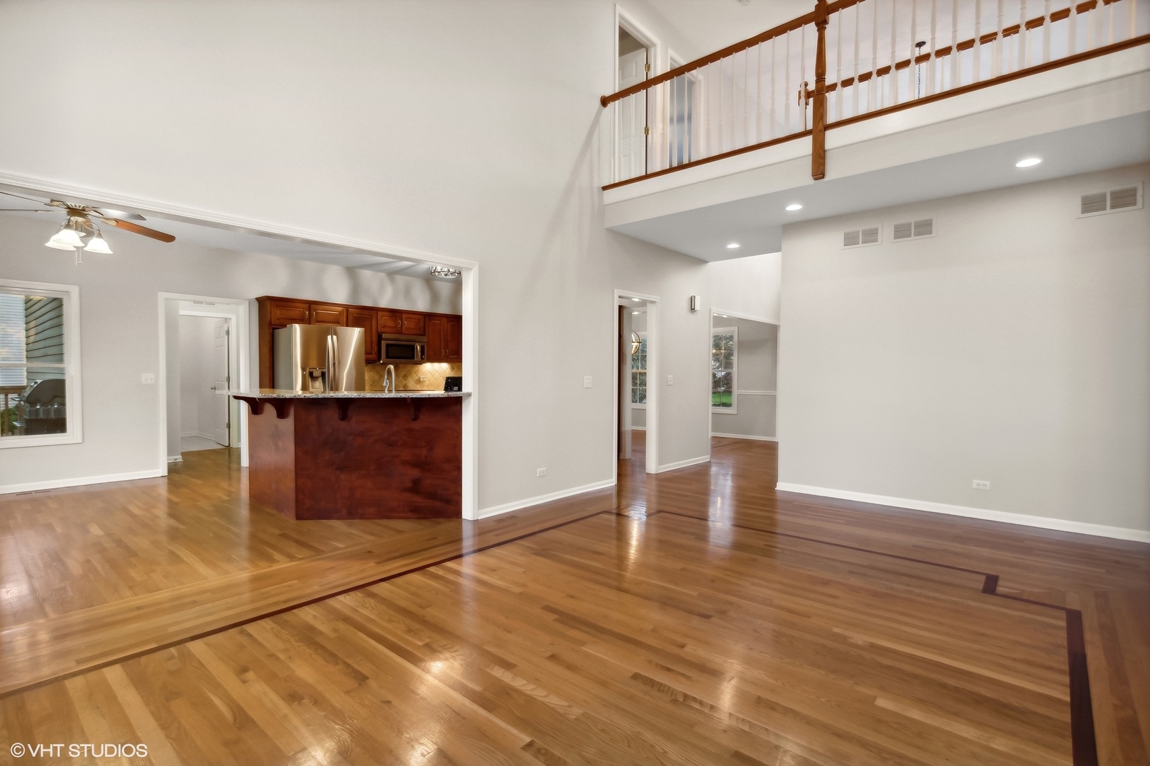 2223 Joyce Lane Naperville, IL 60564 - Photo 11 of 36 a view of a hallway with wooden floor