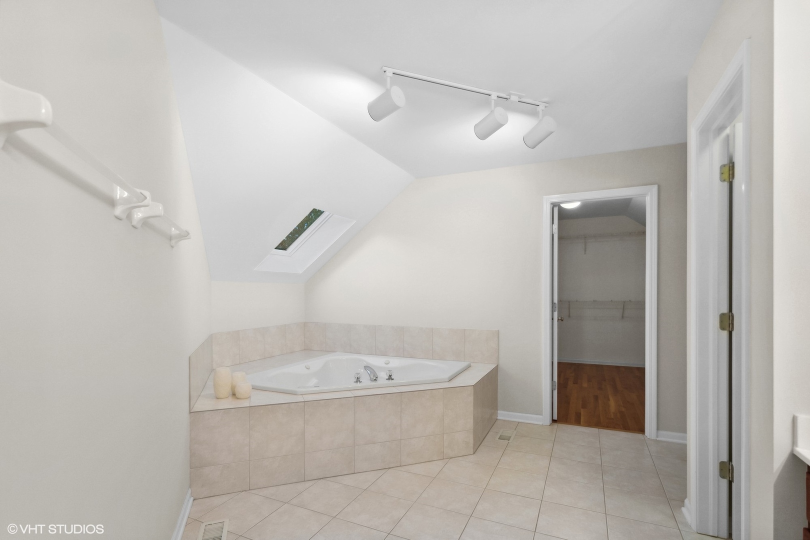 2223 Joyce Lane Naperville, IL 60564 - Photo 16 of 36 a bathroom with a tub and glass door