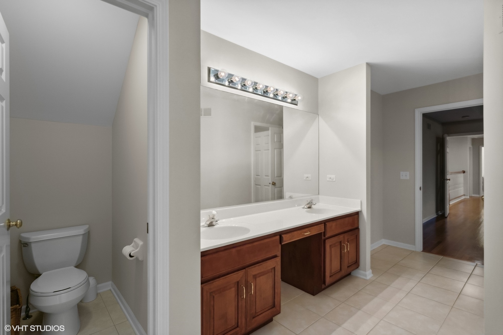 2223 Joyce Lane Naperville, IL 60564 - Photo 17 of 36 a bathroom with a sink a toilet and a mirror