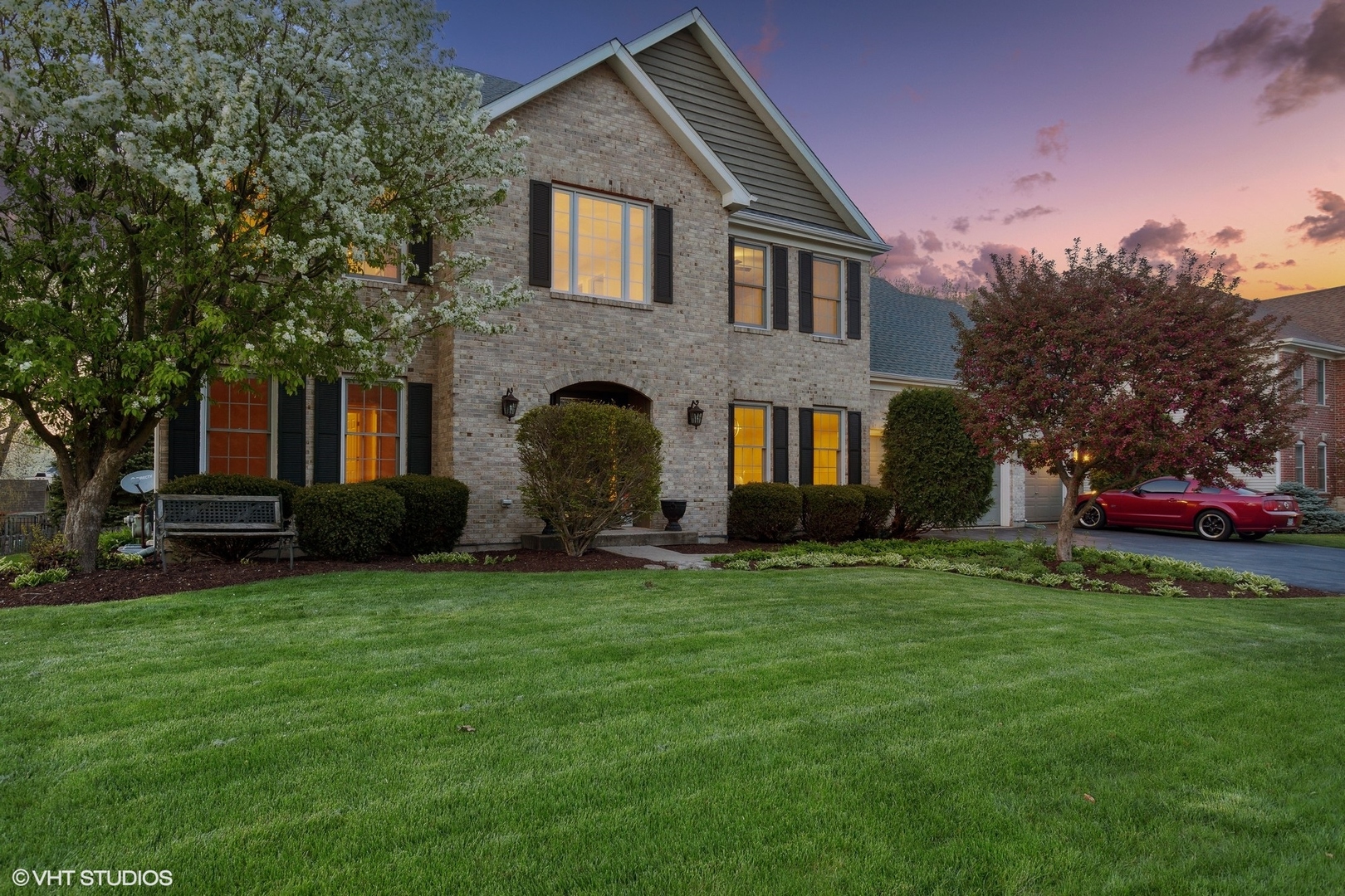2223 Joyce Lane Naperville, IL 60564 - Photo 2 of 36 a front view of a house with a garden and trees
