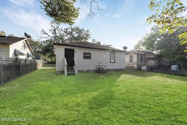 a view of a backyard with a garden and plants