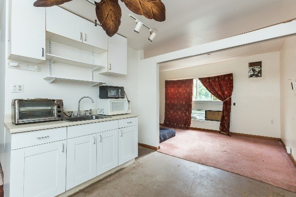 1054 Kealoha Road Kapaa, HI 96746 - Photo 11 of 18 a kitchen with stainless steel appliances granite countertop a sink a stove and cabinets