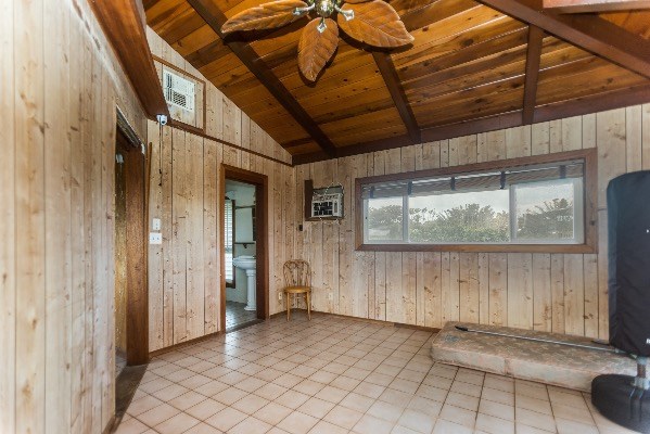 1054 Kealoha Road Kapaa, HI 96746 - Photo 15 of 18 a view of a porch with wooden floor and iron stairs