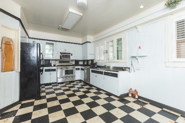 1054 Kealoha Road Kapaa, HI 96746 - Photo 4 of 18 a kitchen with granite countertop stainless steel appliances a sink and cabinets
