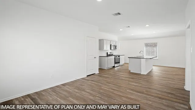 a view of kitchen with wooden floor