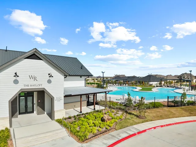 a view of a terrace with a table and chairs