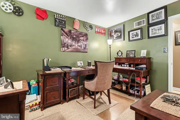 a room with furniture and a bookshelf