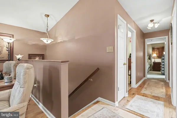 a view of a kitchen from a hallway