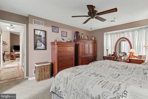 a bed room with a bed and dresser