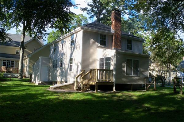 52 Martin Road Wellesley, MA 02481 - Photo 5 of 10 a view of a house with a yard