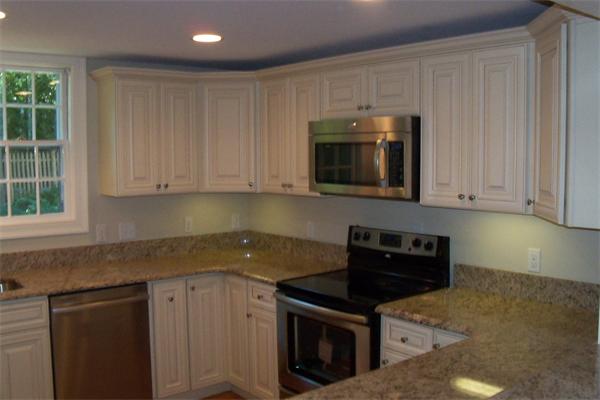 52 Martin Road Wellesley, MA 02481 - Photo 7 of 10 a kitchen with granite countertop a stove a sink and a microwave