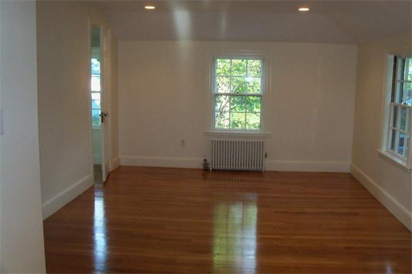52 Martin Road Wellesley, MA 02481 - Photo 9 of 10 an empty room with wooden floor and windows