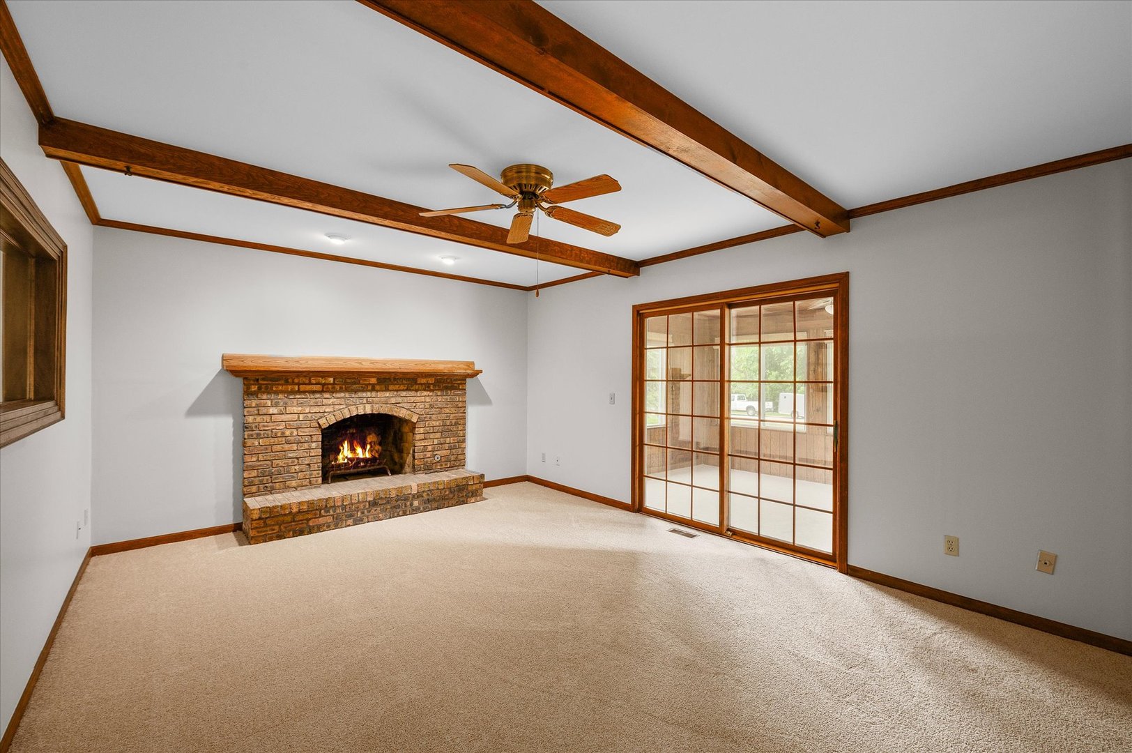 22 Cedar Gate Circle Sugar Grove, IL 60554 - Photo 12 of 35 a view of an empty room with a fireplace and a window
