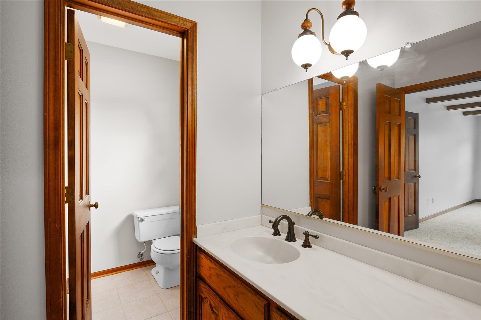 22 Cedar Gate Circle Sugar Grove, IL 60554 - Photo 23 of 35 a bathroom with a sink a toilet and a mirror