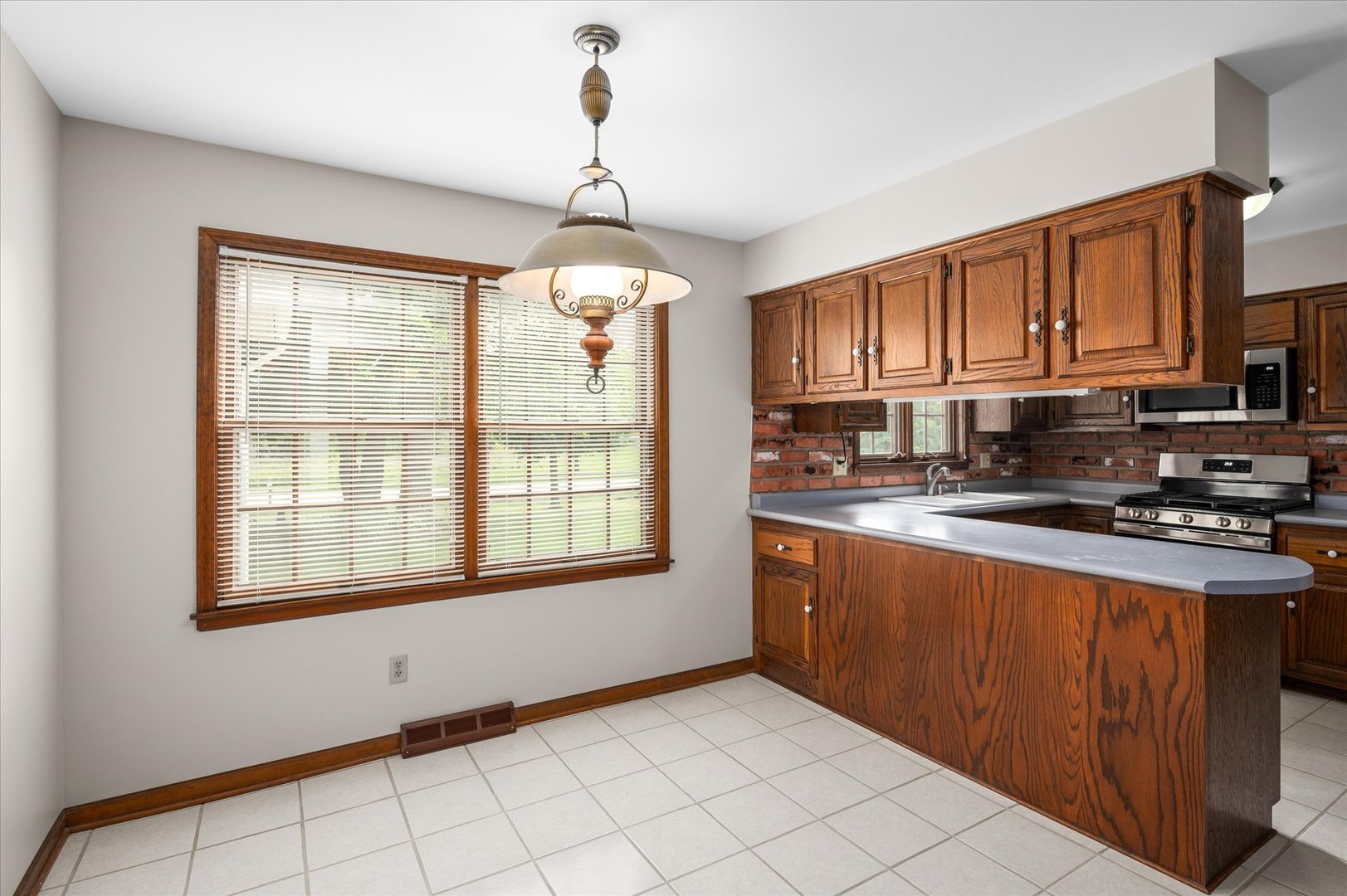 22 Cedar Gate Circle Sugar Grove, IL 60554 - Photo 8 of 35 a kitchen with stainless steel appliances granite countertop a stove a sink dishwasher and a microwave oven with cabinets