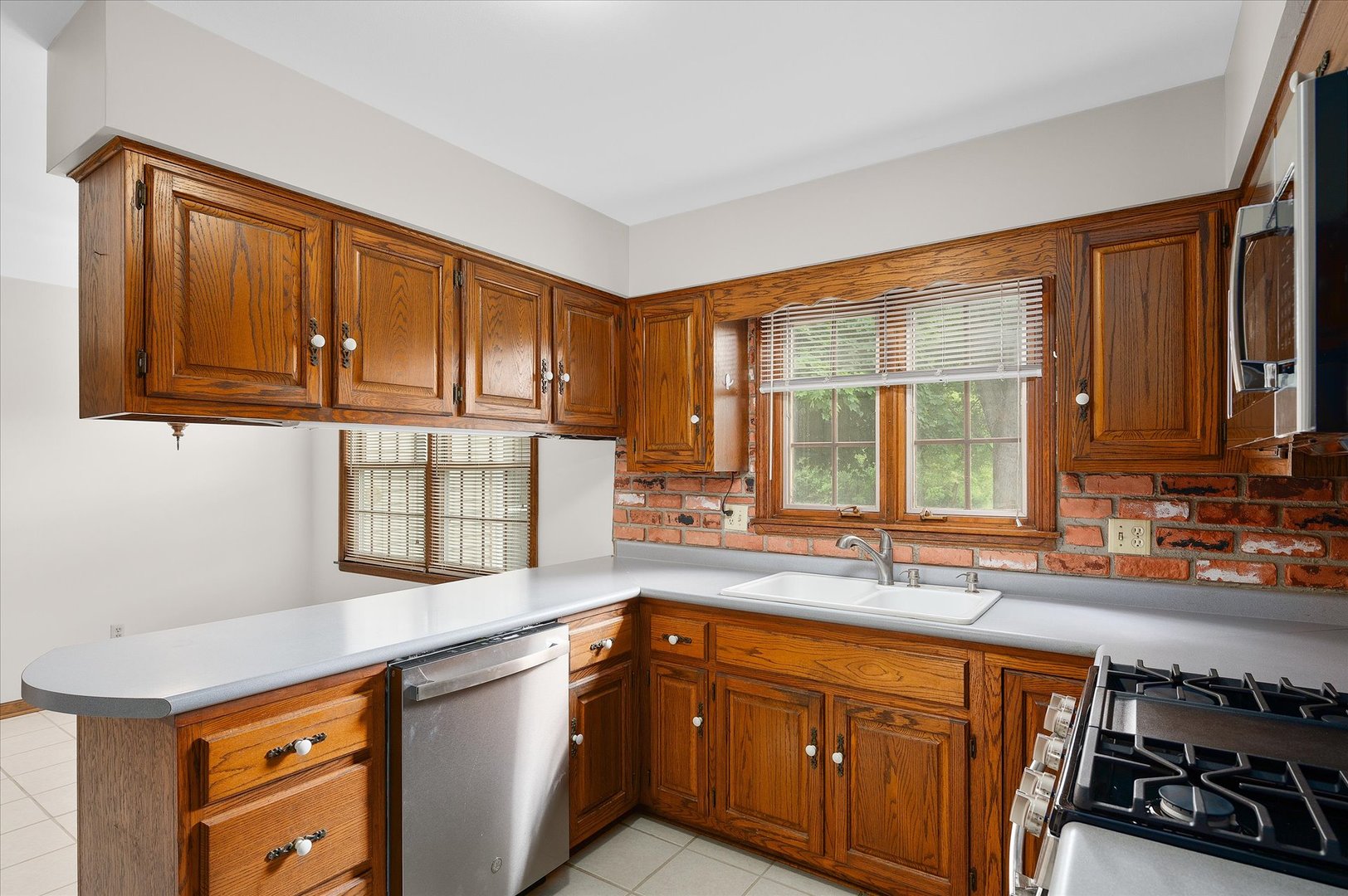 22 Cedar Gate Circle Sugar Grove, IL 60554 - Photo 9 of 35 a kitchen with stainless steel appliances granite countertop a sink stove and cabinets