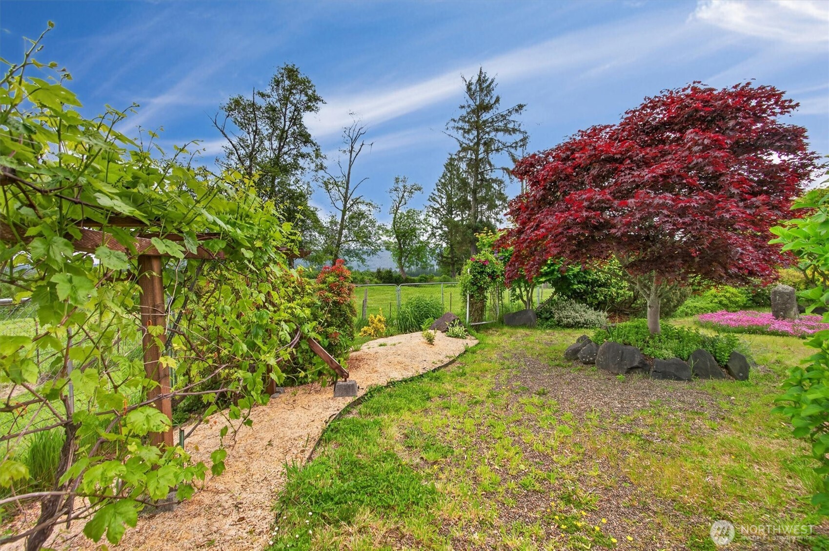 218 West Sunny Sands Road Cathlamet, WA 98612 - Photo 37 of 40 a view of a backyard with plants and a garden