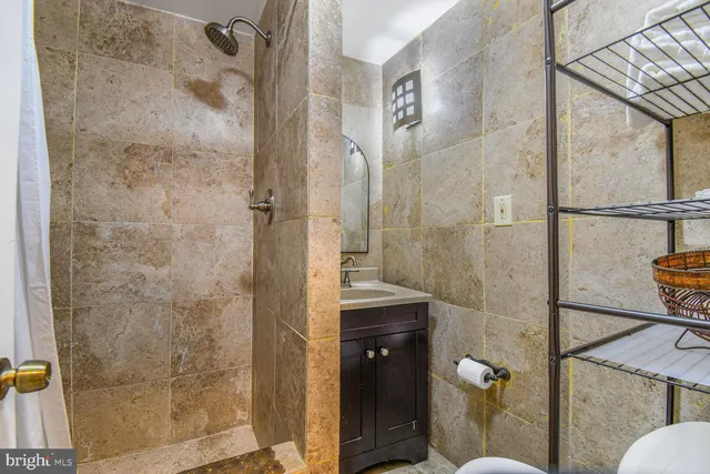 a bathroom with a shower and toilet