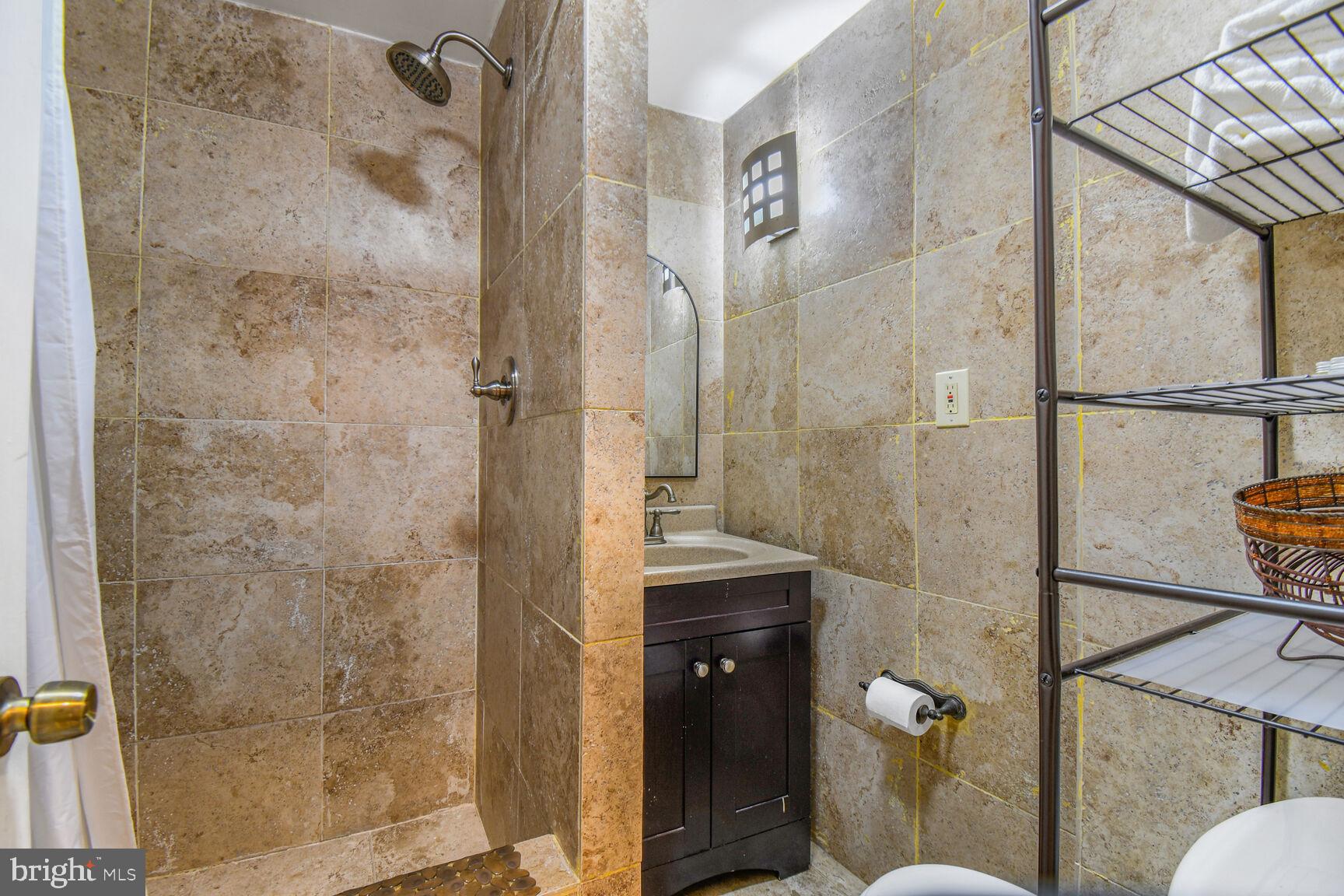 414 Florida Avenue Northwest Washington, DC 20001 - Photo 15 of 24 a bathroom with a shower and toilet