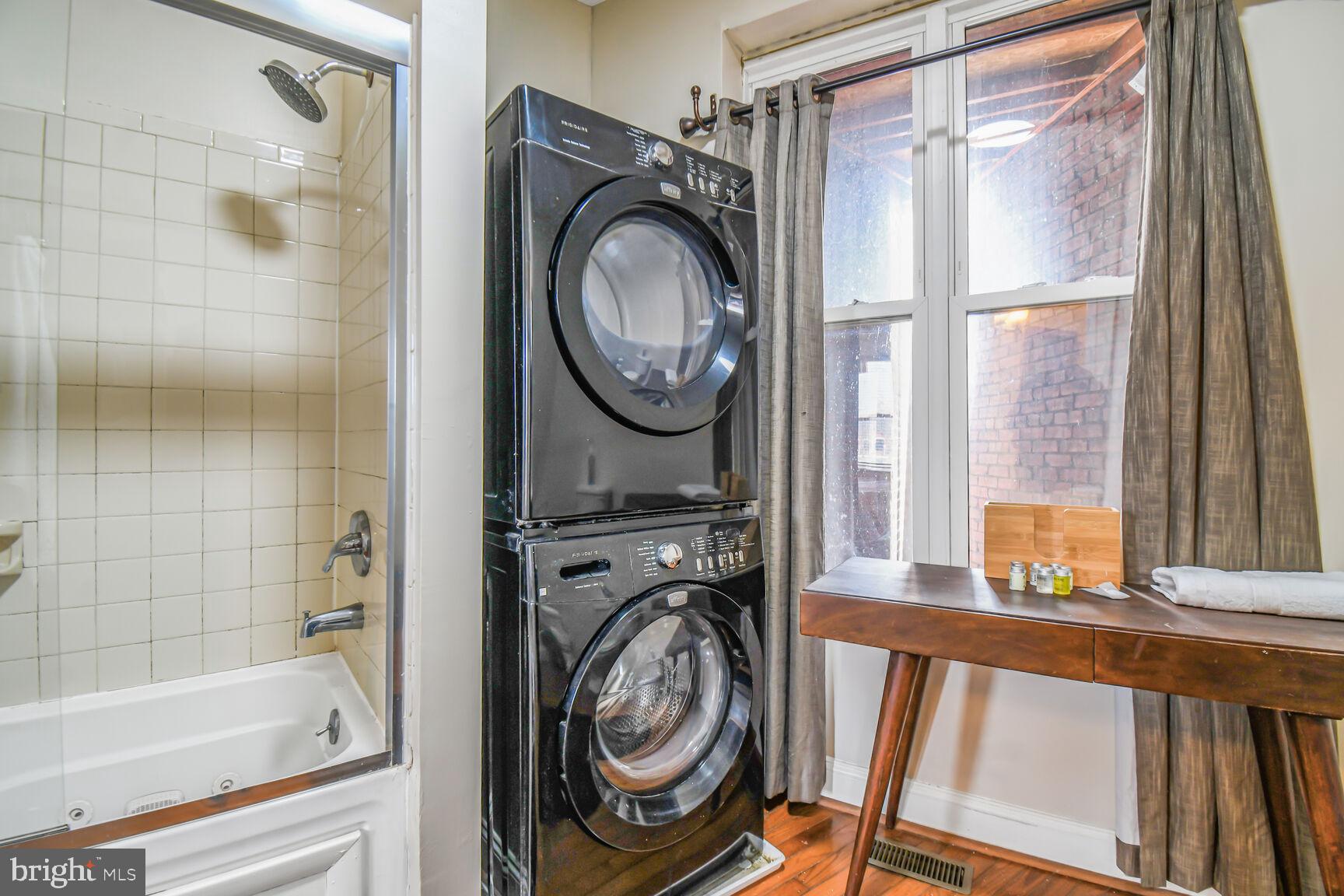 414 Florida Avenue Northwest Washington, DC 20001 - Photo 22 of 24 a view of a bedroom with washer and dryer