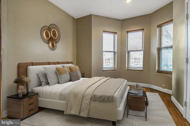 a bedroom with bed and window