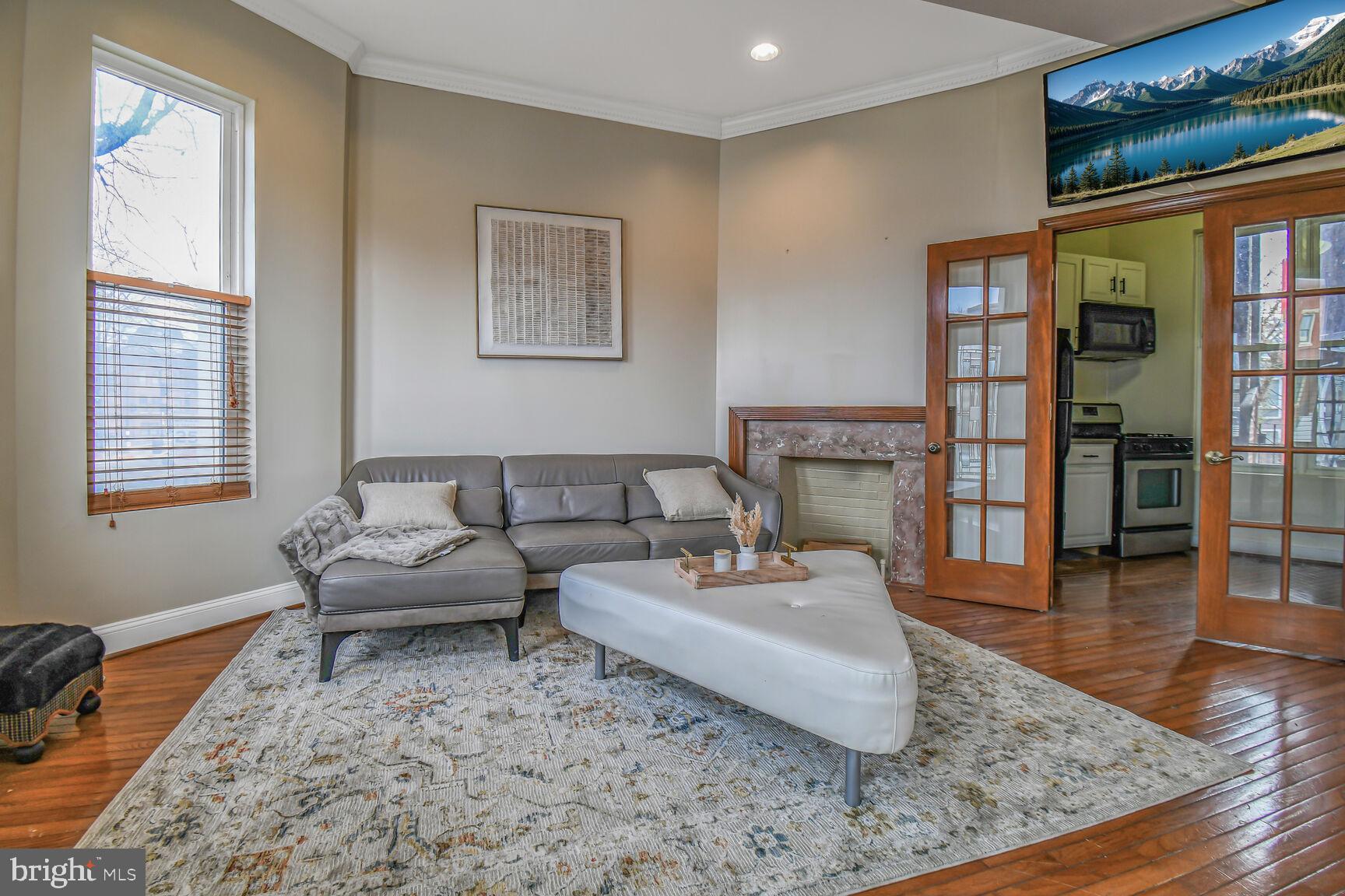 414 Florida Avenue Northwest Washington, DC 20001 - Photo 3 of 24 a living room with furniture and a window