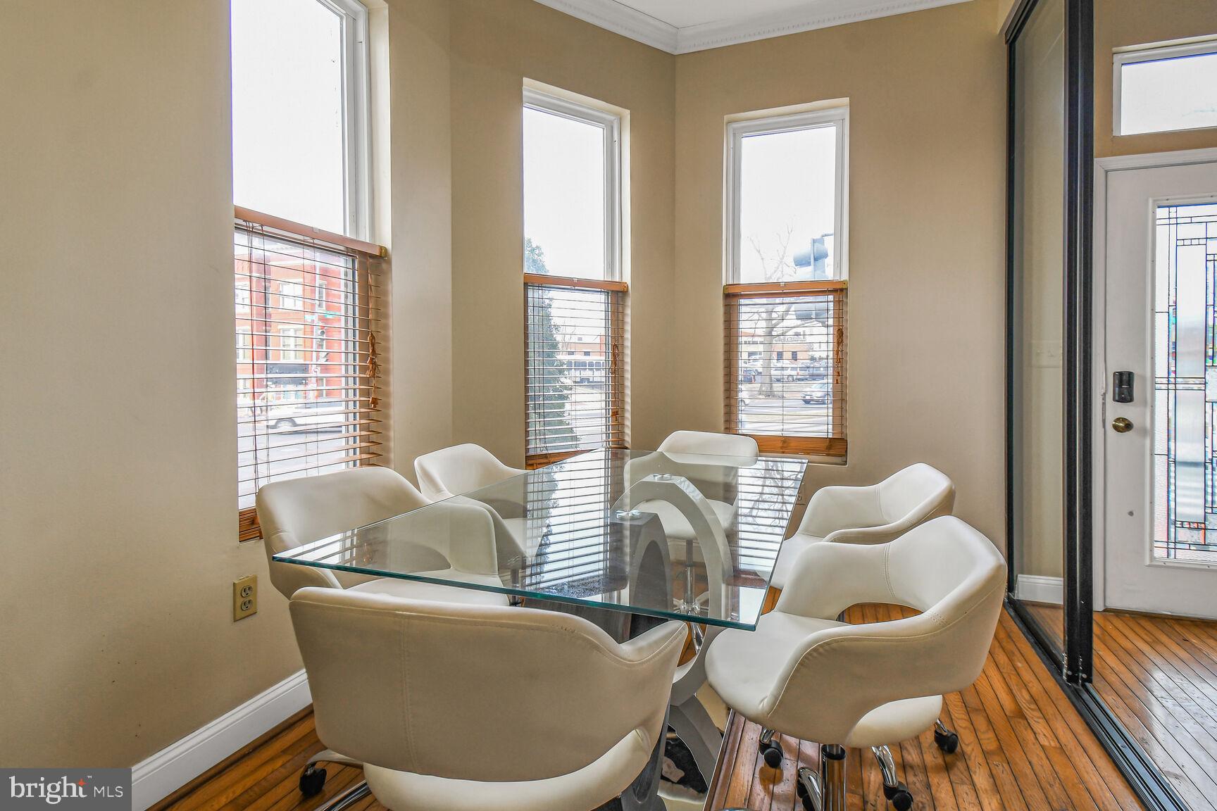 414 Florida Avenue Northwest Washington, DC 20001 - Photo 5 of 24 a dining room with furniture and wooden floor