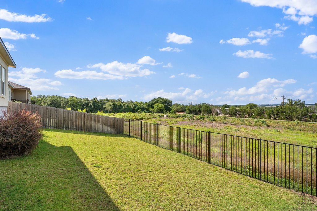 1233 Sweetspire Street Leander, TX 78641 - Photo 32 of 40 Backs to green space with distant Hill Country views and beautiful evening lights.