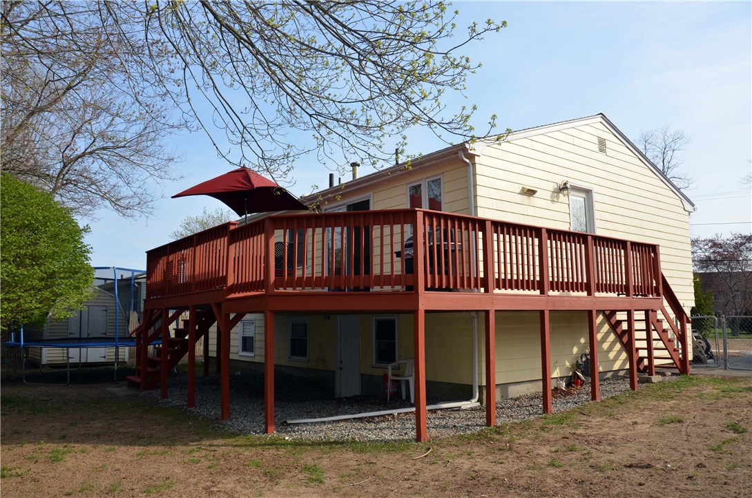 Nice fenced back yard, wrapped deck, full walkout finished lower