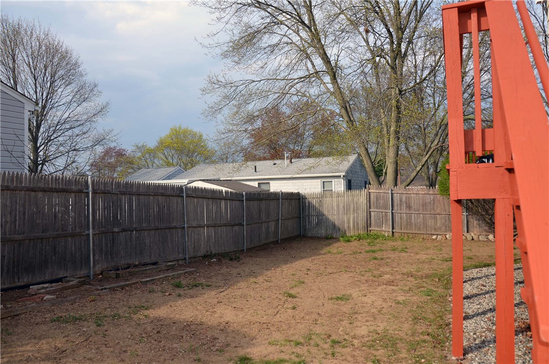 Fenced in back yard, well maintained, just waiting for grass!