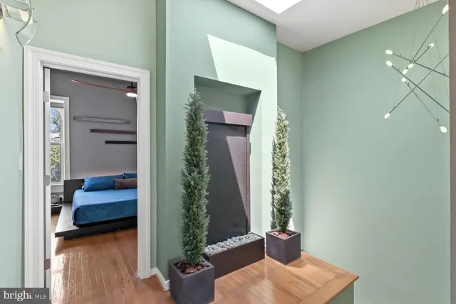 a bedroom with bed and chair