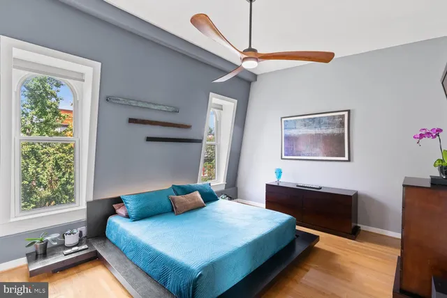 a bedroom with a bed and window