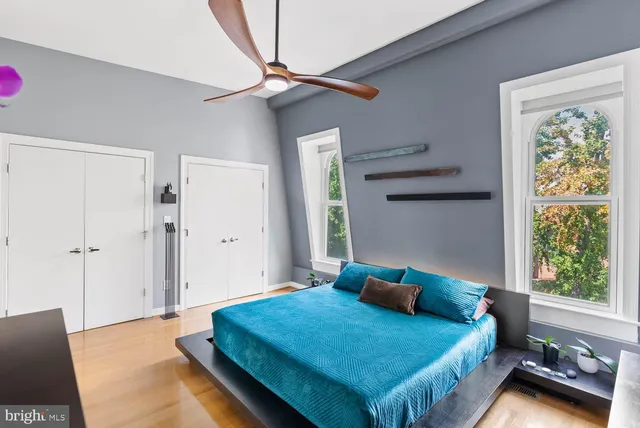 a bedroom with a bed and a window