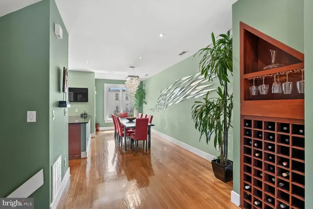 a view of a dining room with furniture and wooden floor