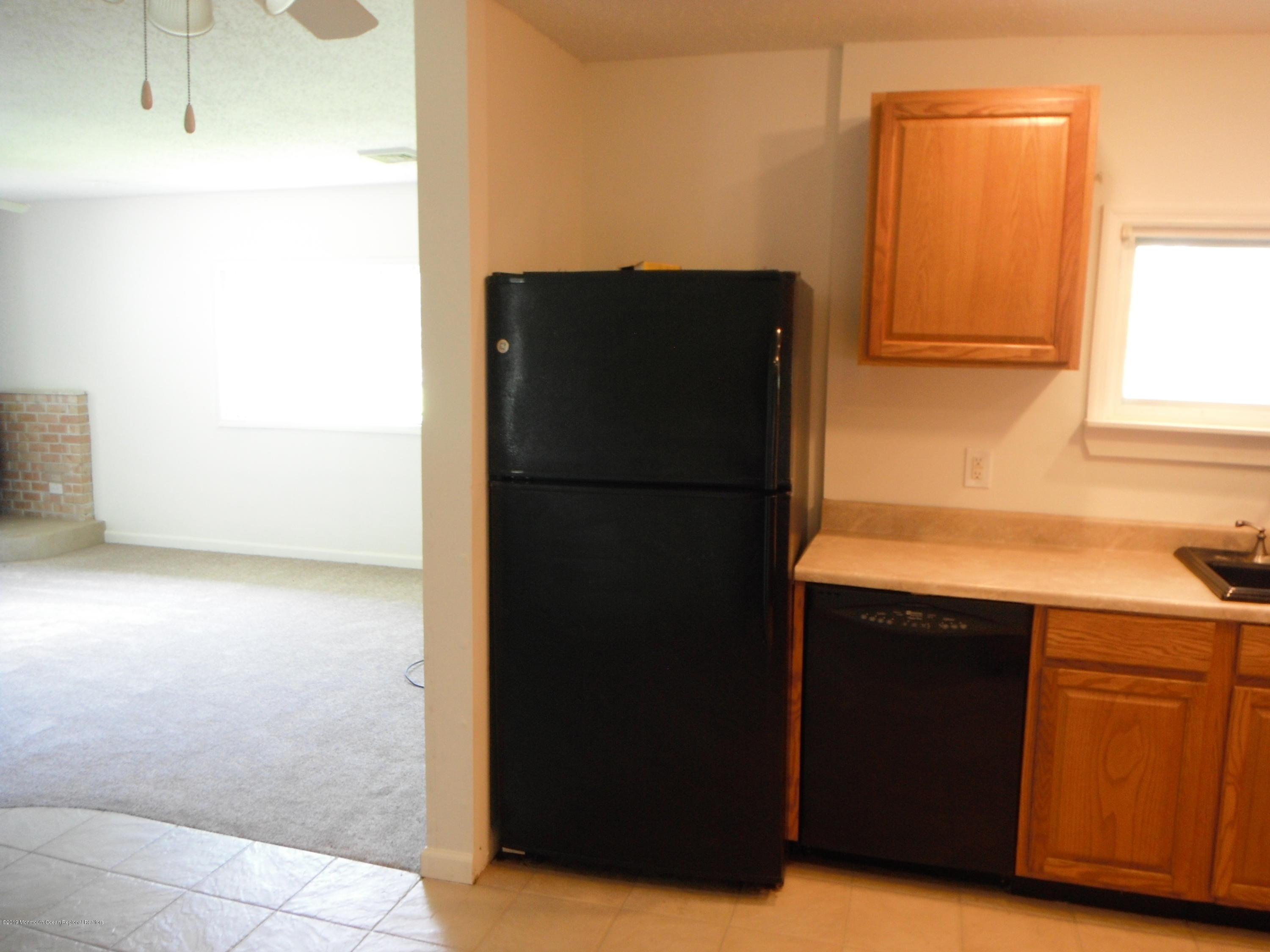 3 Colonial Drive Little Egg Harbor, NJ 08087 - Photo 12 of 21 a kitchen with a refrigerator and a sink