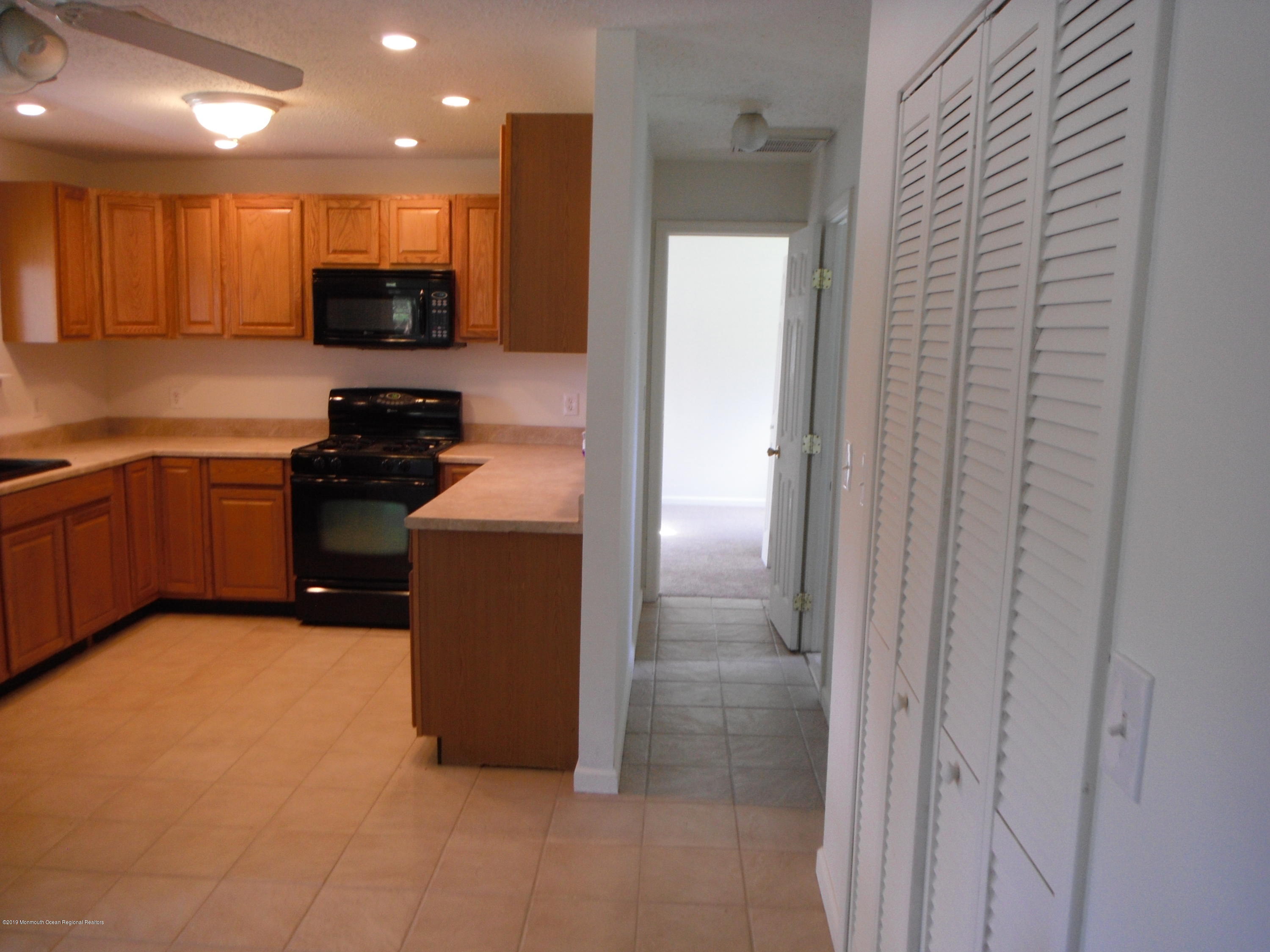 3 Colonial Drive Little Egg Harbor, NJ 08087 - Photo 13 of 21 a kitchen with a refrigerator and a sink