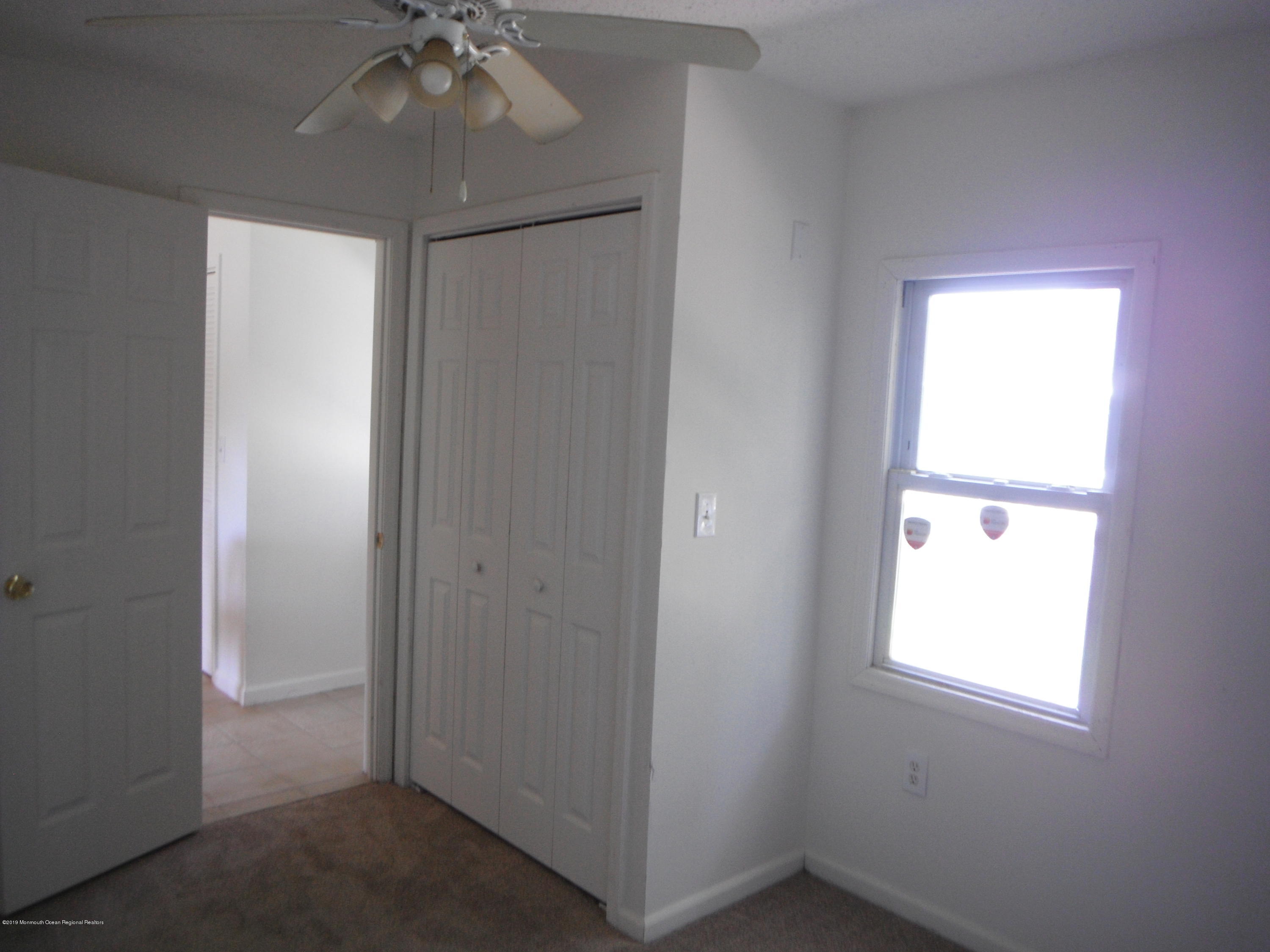 3 Colonial Drive Little Egg Harbor, NJ 08087 - Photo 15 of 21 a view of an empty room with a window